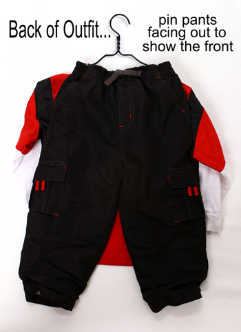 On the back of sets, pin the pants facing out to show the front.
